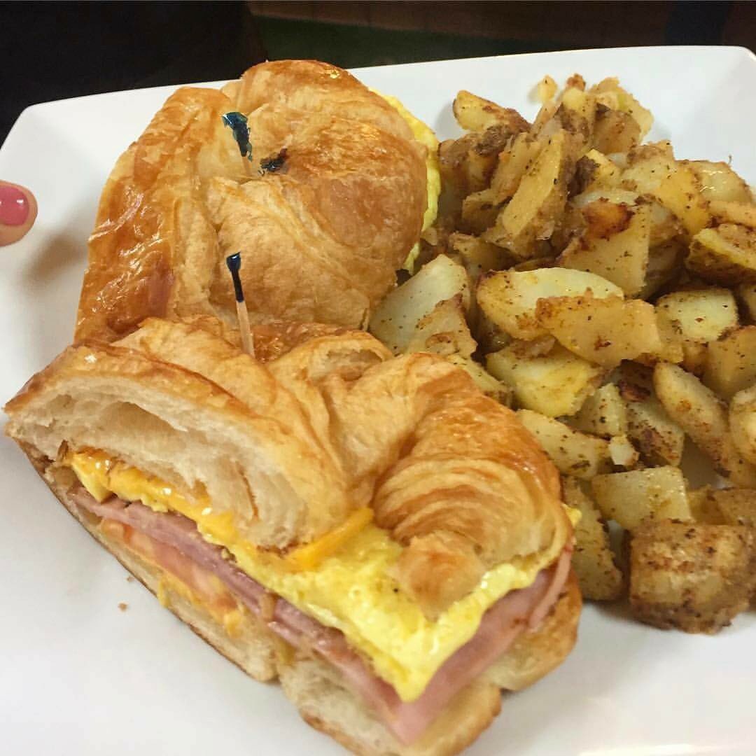 #HappySunday! Try our #Breakfast #Croissant! Two #eggs, tomato, cheese, #ham or #bacon! Served with home style potatoes!