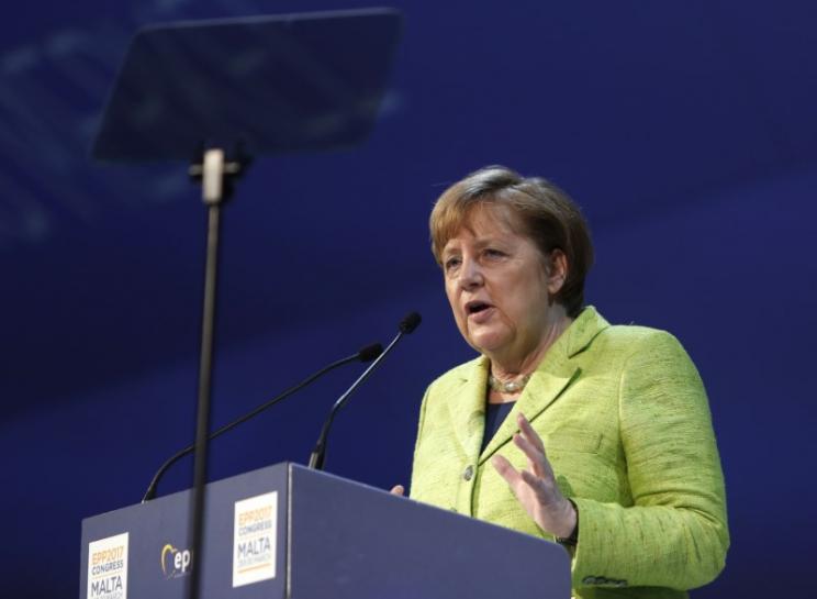 Reuters's tweet photo. Merkel says migrants must respect tolerance, German laws https://t.co/SYKwmZvRl9 https://t.co/FNnhgmT3qu