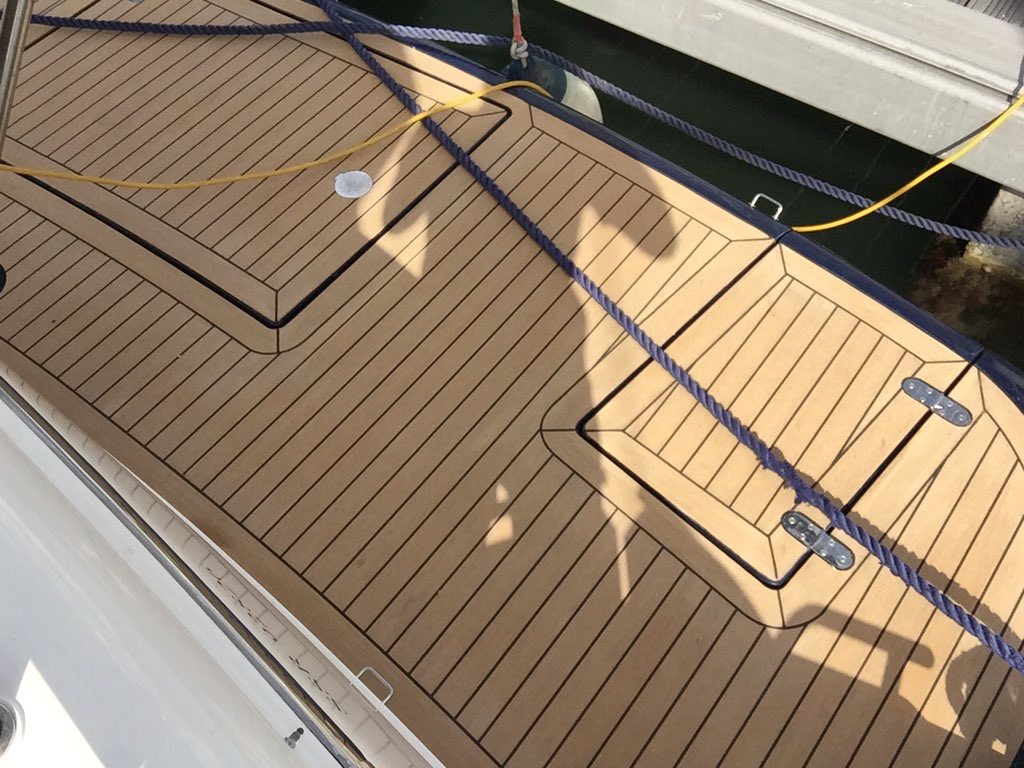Cockpit and swim replacement in classic composite teak decking. All ready for the new season enjoy!