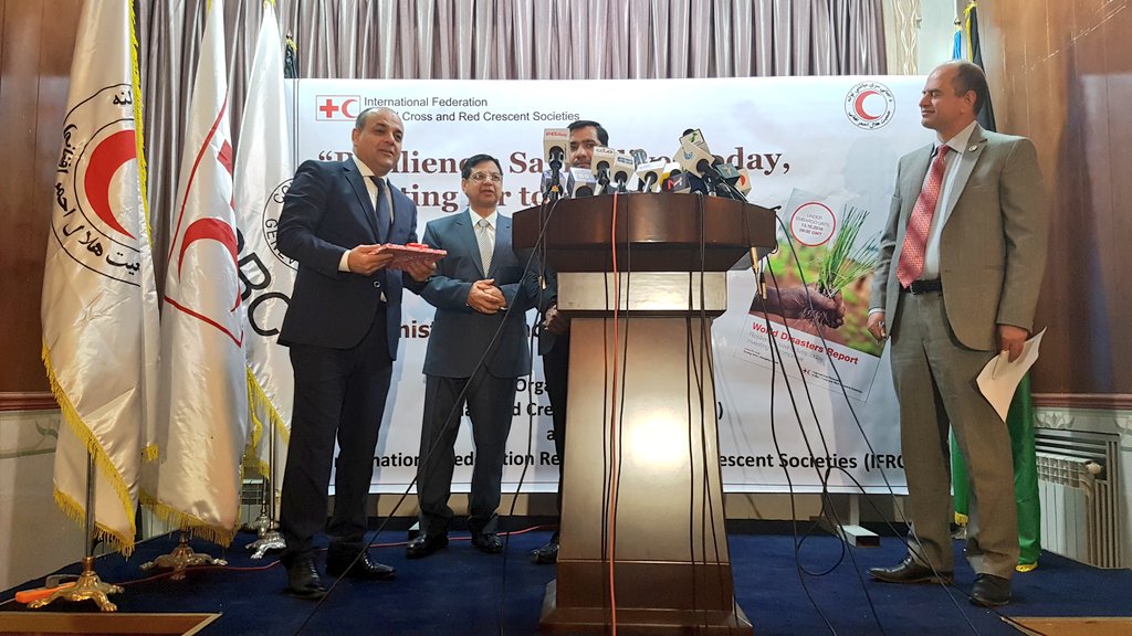 A_Kestens's tweet photo. Investing in #resilience saves lives and money. Handing over a copy of the @Federation #WDR2016 to State Minister Wais Barmak #Afghanistan https://t.co/egfhxrRPOY