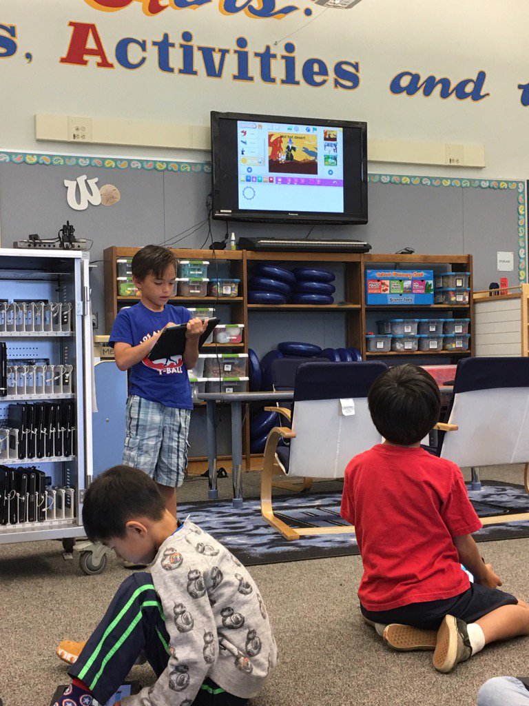 DrDTom's tweet image. 1st grader sharing something he just discovered in Scratch Jr. with classmates! @Weaverwhales #LosAlCodes #ScratchJr