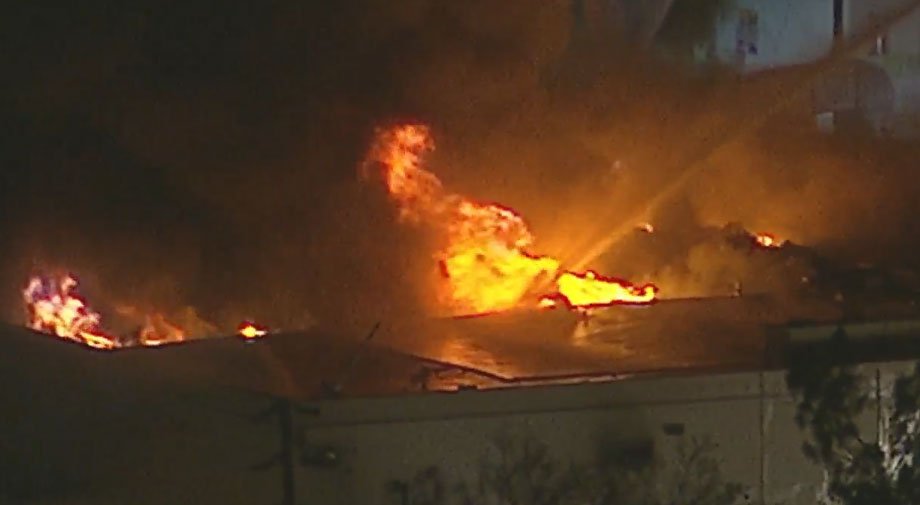 ABC7's tweet photo. WATCH #LIVE: Firefighters battle flames in large South LA commercial building https://t.co/C8nRNwa2wB https://t.co/i6woHaSiaK
