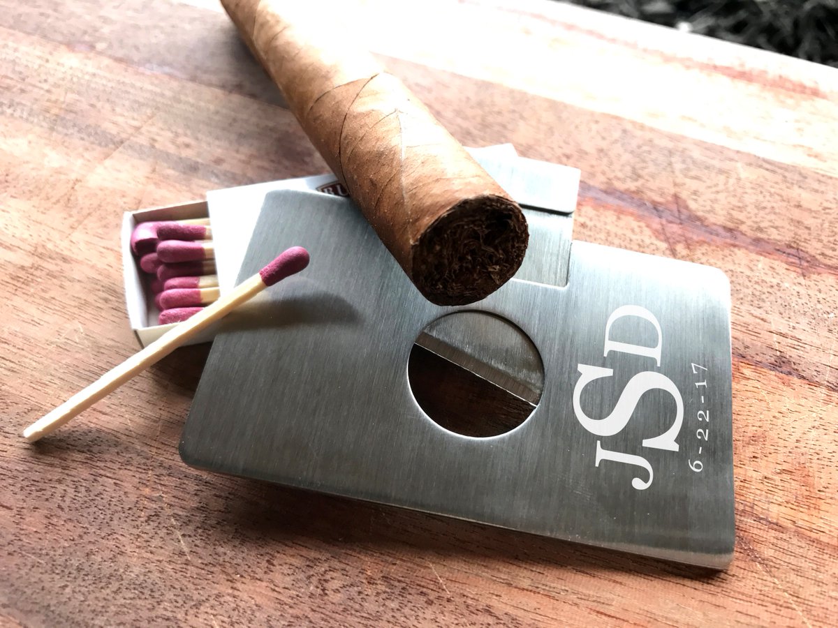 Expressedi's tweet image. Engrave your guy's initials, favorite logo, or your anniversary date in this wallet sized stainless steel, cigar cutter. #guygifts #cigars