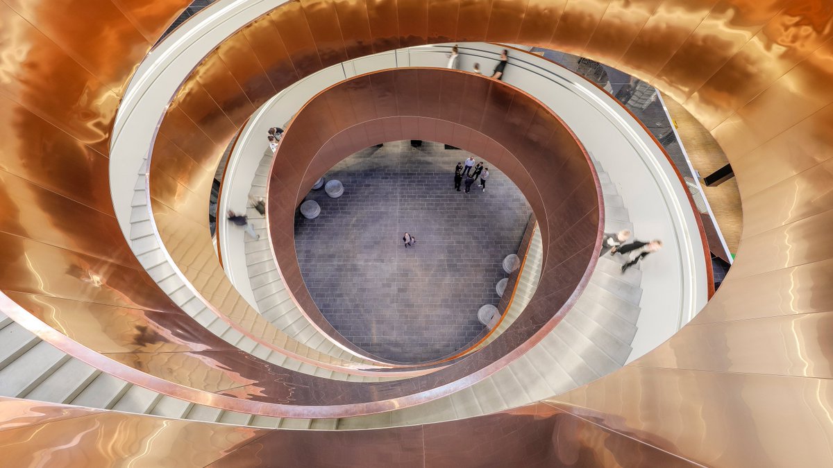 dezeen's tweet image. Copenhagen's Experimentarium features a helical staircase and cladding based on fluid dynamics: on.dezeen.com/bNaxQg