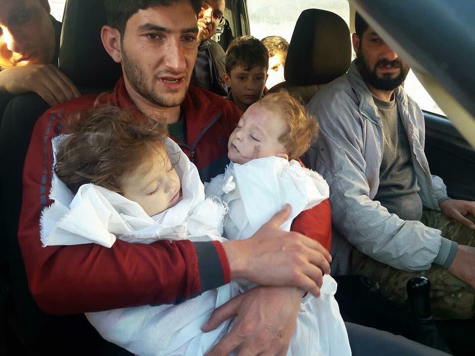 Abdulhamid Alyusuf, He lost 20 of his family in the Chemical attack in #khancheikhoun and these are his twin kids giving them the last hug..