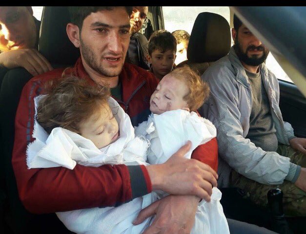 wirecheck's tweet photo. The look of this father carrying his two children after the chemical attack in Syria encompasses all of the injustice of this world https://t.co/3Zv97lcvcw