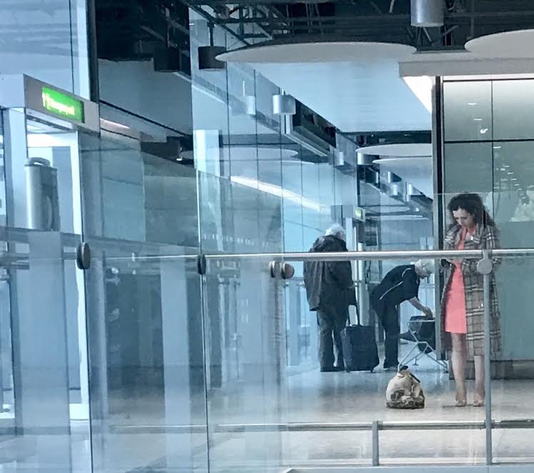 SNP's <a href="/TasminaSheikh/">Tasmina Ahmed-Sheikh</a> waiting for bag carrying assistant to get off from the back of the plane at Heathrow.  She was in seat 1A of course...