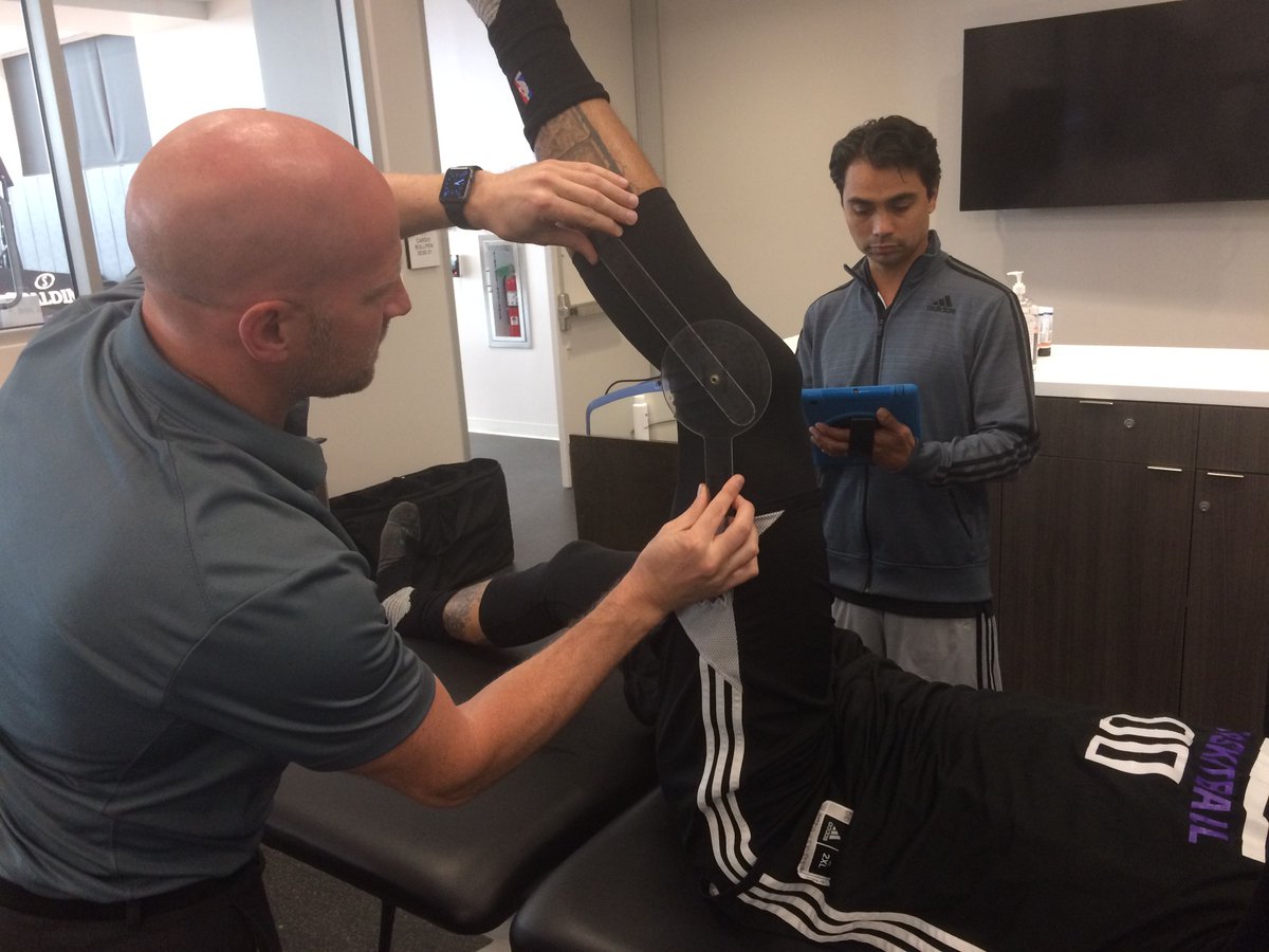 fusionetics's tweet photo. Erik Phillips of Fusionetics (left) and Sacramento Kings Head Athletic Trainer Dr. Manny Ramero performing movement assessments this week. https://t.co/jh702tfLwt