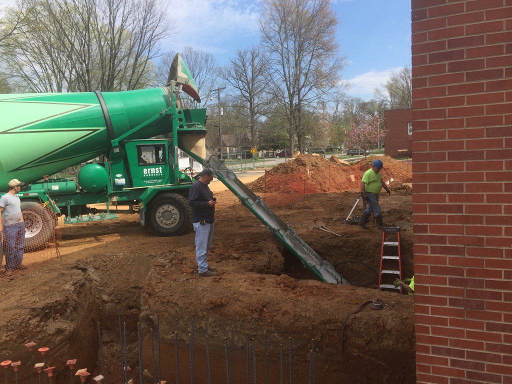 GregSBarr's tweet photo. A few big holes and a lot of concrete!  Starting to pour foundation of children's building! https://t.co/e3oUYmnZC1