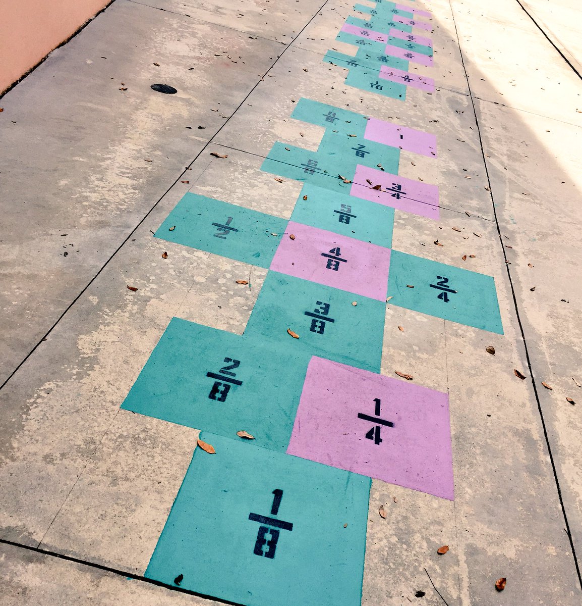teacher2teacher's tweet photo. Check out the fractions on the hopscotch court at educator @tricia_fusco's school! How do you combine school &amp; play? https://t.co/koy7133LKn https://t.co/joajdFwNcb