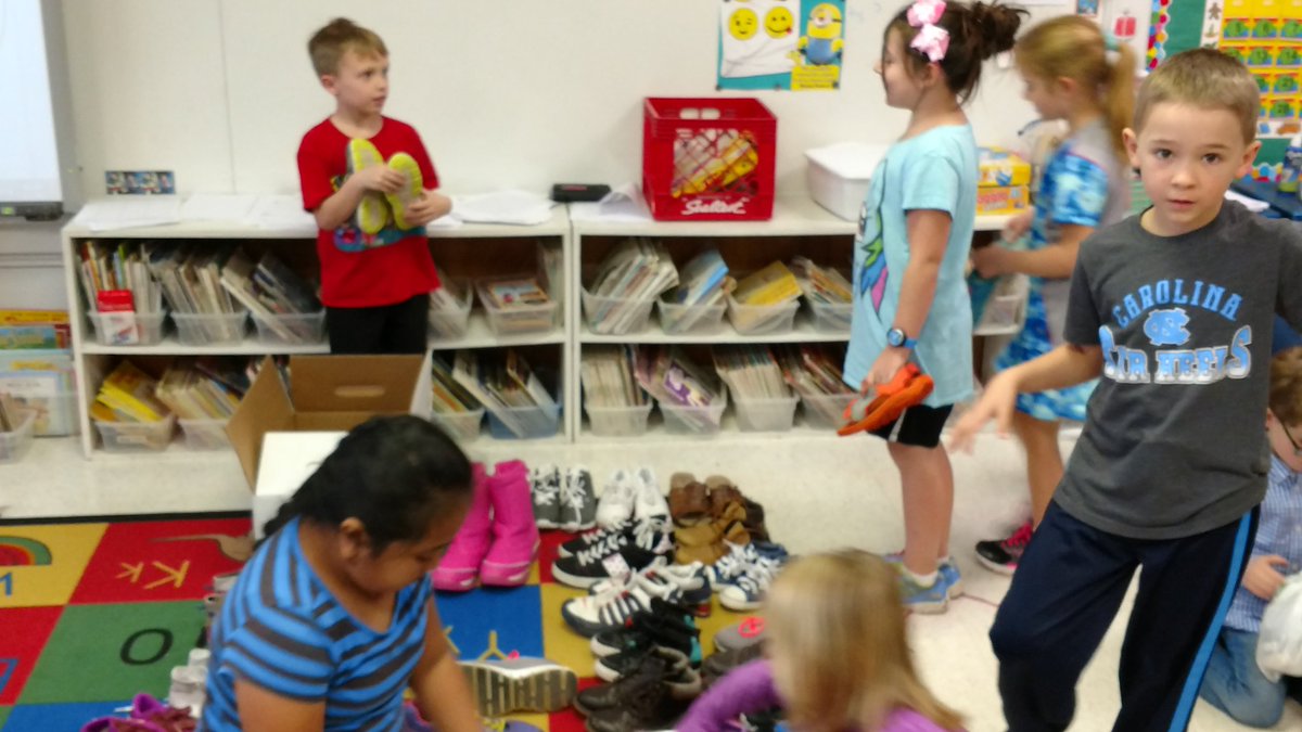 AgnerMatthew's tweet image. Using whiteboards and markers and drawings to count over 500 pairs of shoes first grade collected to give away.