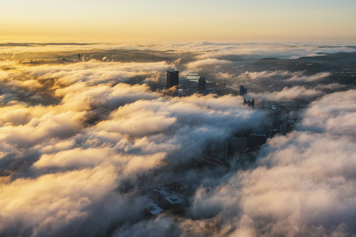 A 'river' in the fog leads right to the Monongahela River in #Pittsburgh as golden morning light floods the Steel City in this aerial view