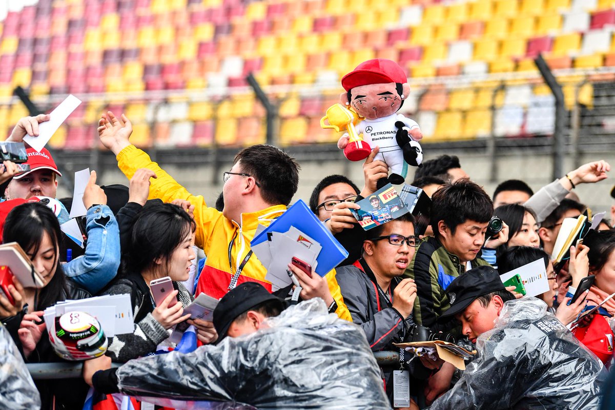 F1's tweet photo. Star spotting in the #ChineseGP pit lane 🇨🇳 ☂️ https://t.co/sArGvfqp8Q