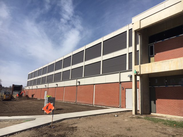 MedHatHigh's tweet photo. Outside "grooming" taking place on the main side (7th St SW) of MHHS in anticipation of the gym opening to PE classes! #MHHSModernization https://t.co/c18wxWP8Kj