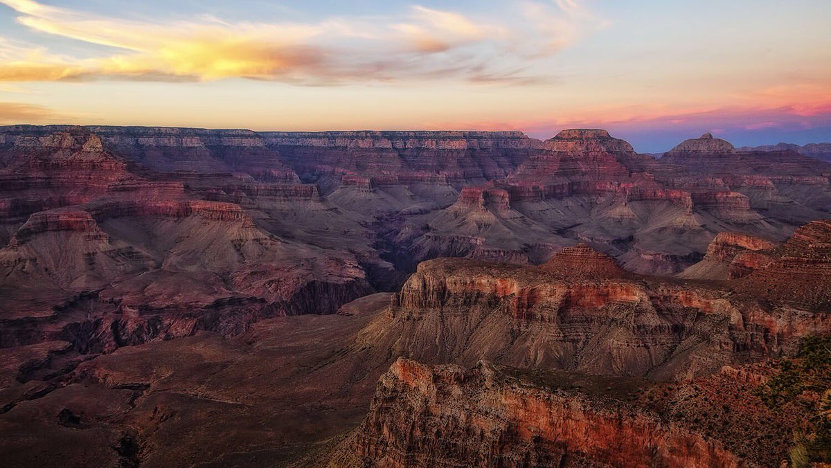 The Grand Canyon glows red in the sun