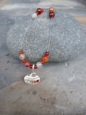 Hogline1's tweet photo. SALE SPECIAL - assorted curling rock necklaces were in the $60 range NOW $25. SALE continues 10 to 6 daily until April 30. #HOGLINE1 https://t.co/C162KpKIOu