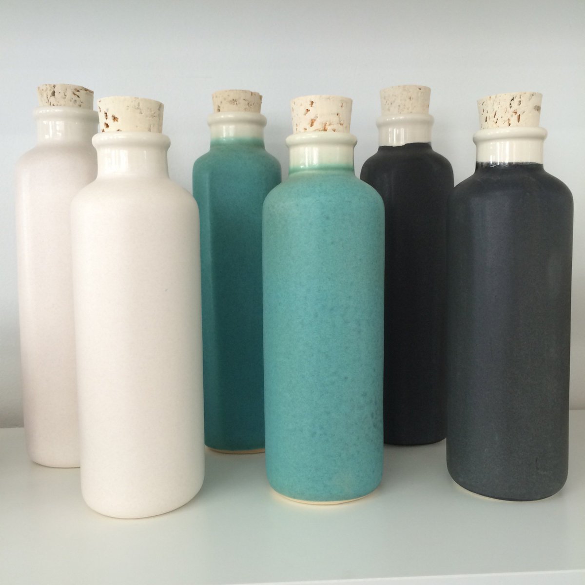 Meet Earth-In Canteen! A sustainable stoneware water bottle made in California with lead-free glaze and natural cork stopper. #newwest