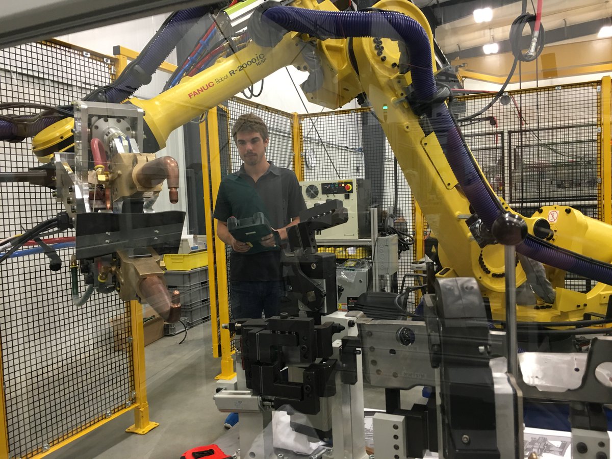 Jordan is teaching weld points for an REI-designed robotic weld cell for automotive body components.