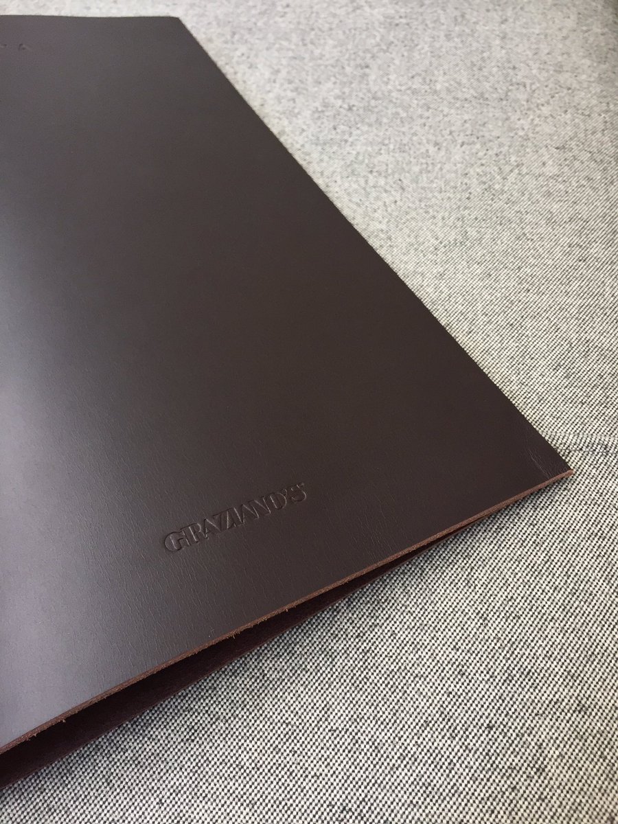 LYstudio's tweet photo. It's all in the details: salivating over this blind deboss on leather sample for @Grazianos_group #design #print #GraphicDesign #menudesign https://t.co/fgfyrCo1IV