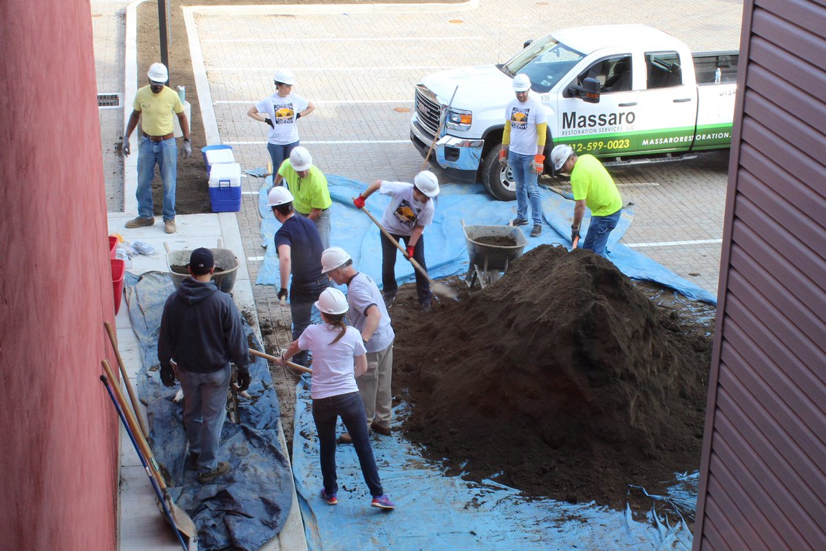 MassaroCG's tweet photo. Day of Service: Massaro employees spent this sunny day doing some landscaping for The @MidwifeCenter! #transformTMC https://t.co/K8SmPatIuR
