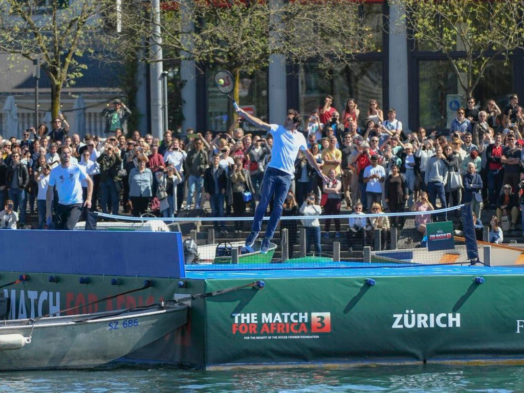 SABreakingNews's tweet photo. Pic of the Day: Federer plays on water #picoftheday #MatchForAfrica #FedererMurray #backhandboys #Zurich https://t.co/arVoGiGGnJ https://t.co/busF3m91EQ