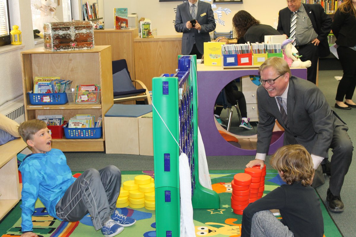 StMargueritecs's tweet photo. Julie &amp; Brody lead the Minister Eggen and Evergreen on school tour! #Rejoice #LearningCommons #WOWZERS https://t.co/FO7w1GSGj6