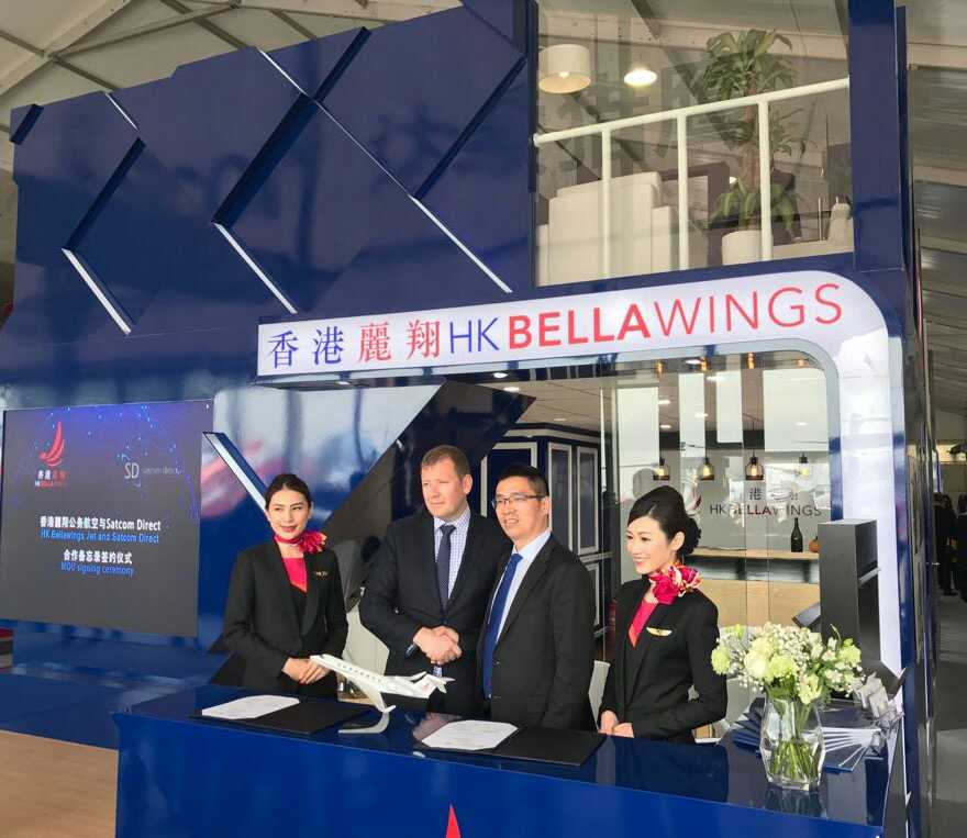 GogoAviation's tweet photo. @SatcomDirect CCO, Chris Moore, signs a partnership with HK Bellawings as their preferred connectivity service provider #ABACE2017 . https://t.co/gNkkd3vWIB