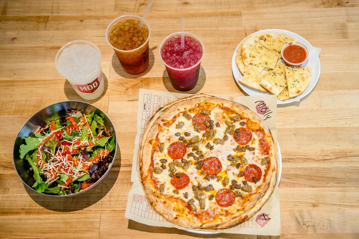 MODPizza's tweet photo. A full MOD spread - featuring a Strip, Salad, Pizza, and not 1 but 3 drinks! #MODpizza #Pizza #orderfor1 https://t.co/e7nYngGa6e