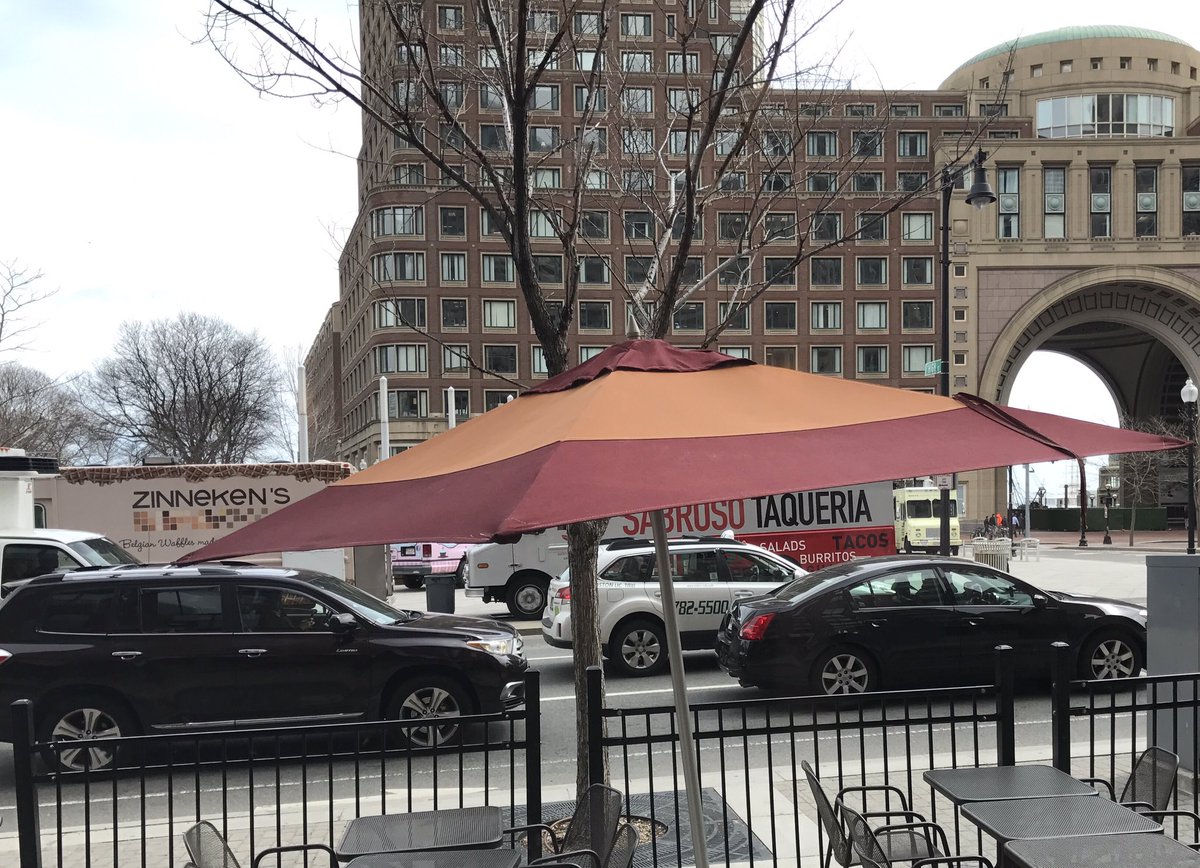 VeryJosie's tweet photo. Here's the view (of food trucks) from Panera's window, along with the Boston Harbor Hotel. #boston #wherespring https://t.co/7TeWTflOej