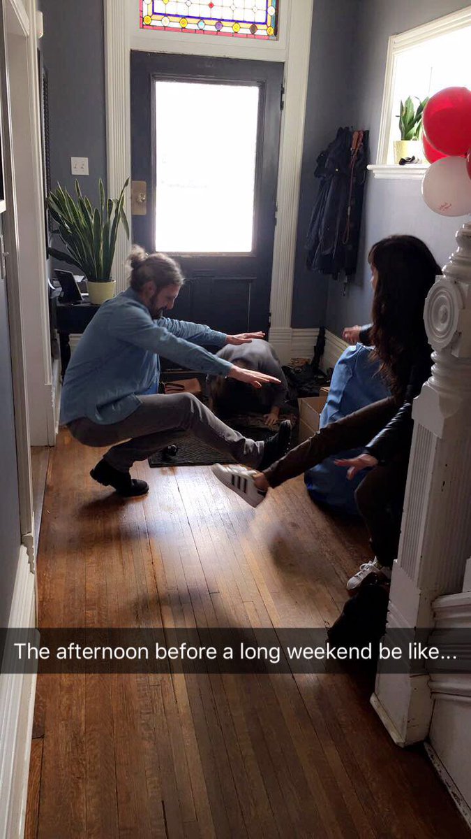 Coworker yoga-off:
<a href="/Chan_Rahan/">Catherine Hanrahan</a> doing some sort of bird pose, <a href="/FILM_kelly/">Jeremy Blair Kelly</a> showing <a href="/JessMelnik/">Jessica Melnik</a> how to do a pistol squat, pic by @sarahmcmikes.