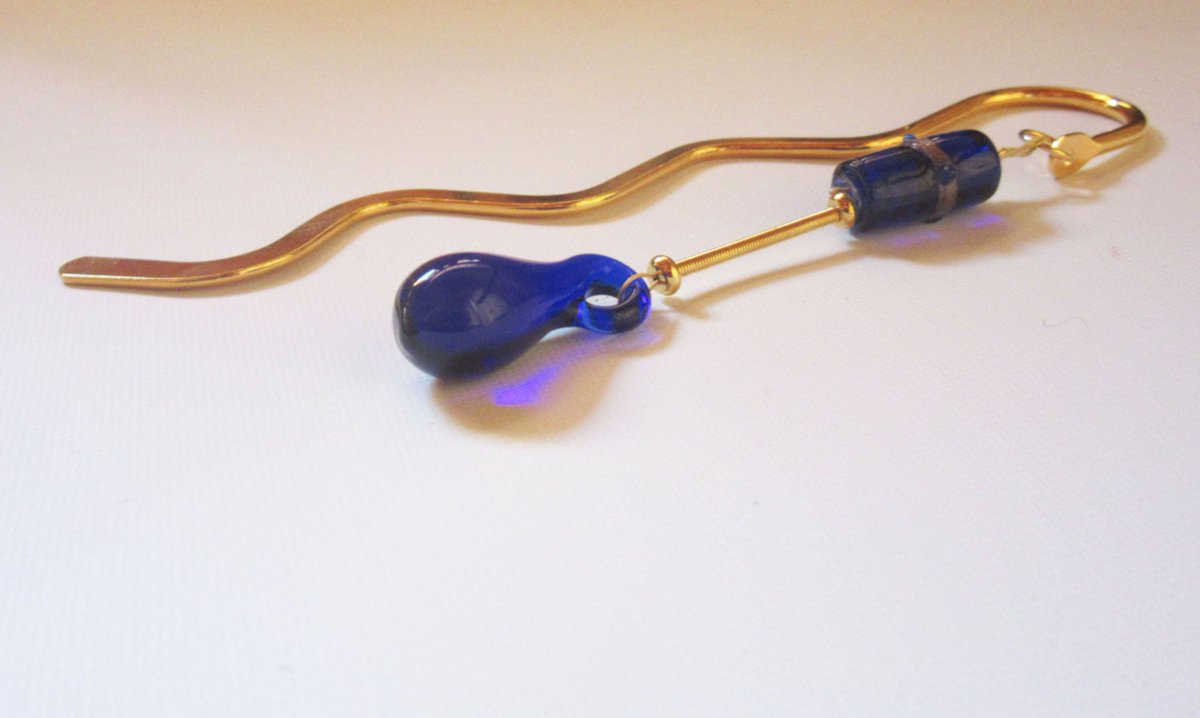 Gwynstone's tweet photo. cobalt blue glass bookmark - squiggle metal bookmark - gold metal book… https://t.co/m5lEduS4TT #Etsy #GiftForReader https://t.co/YKzCUUsTRs