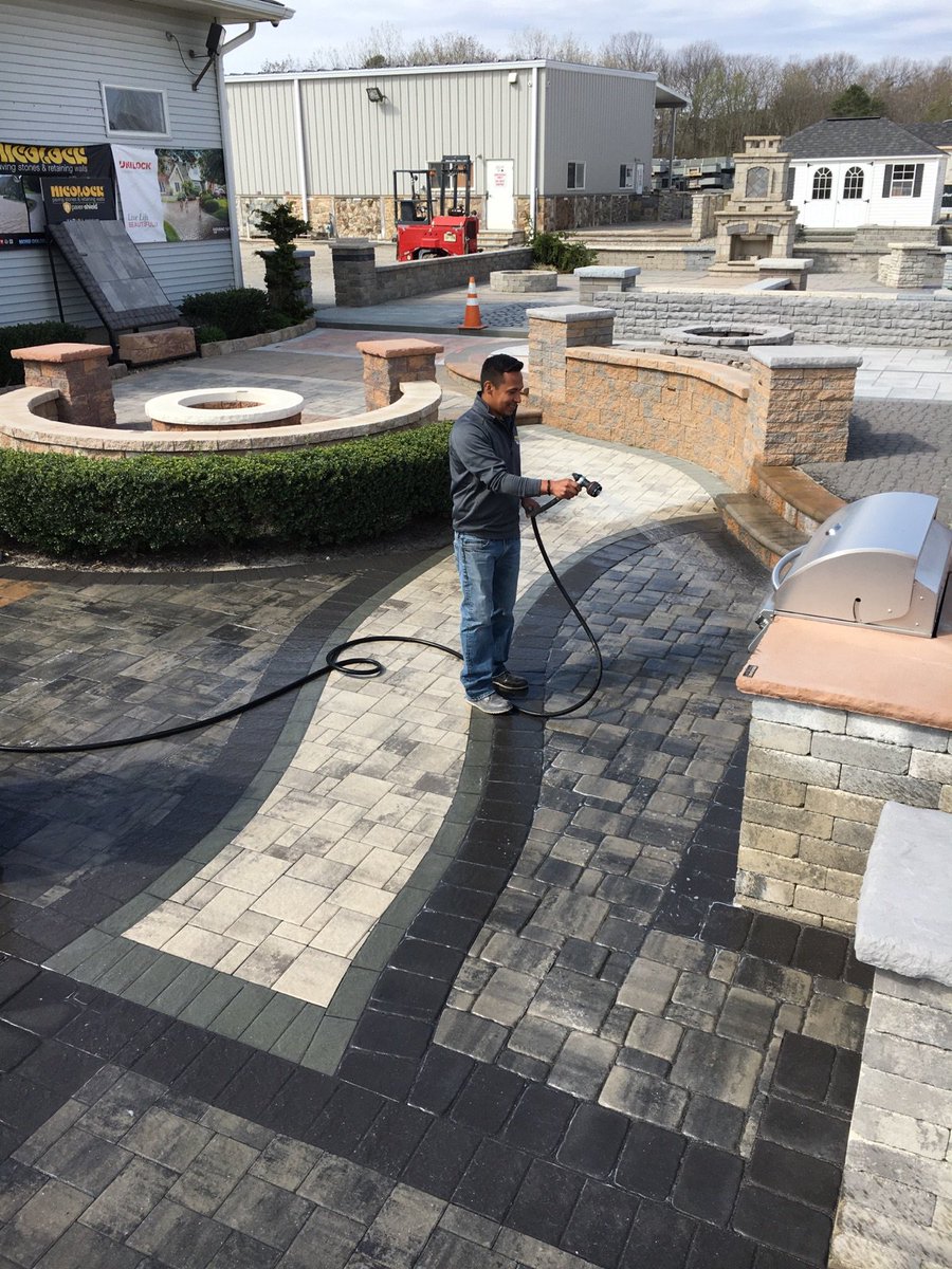 AllianceGator's tweet photo. What do we do on a sunny Friday? ☀️ Spruce up displays! Kevin Minton is out helping @NicolockPaving Sales Rep, Jesus (shown), with sanding! https://t.co/BcsN4pZaae