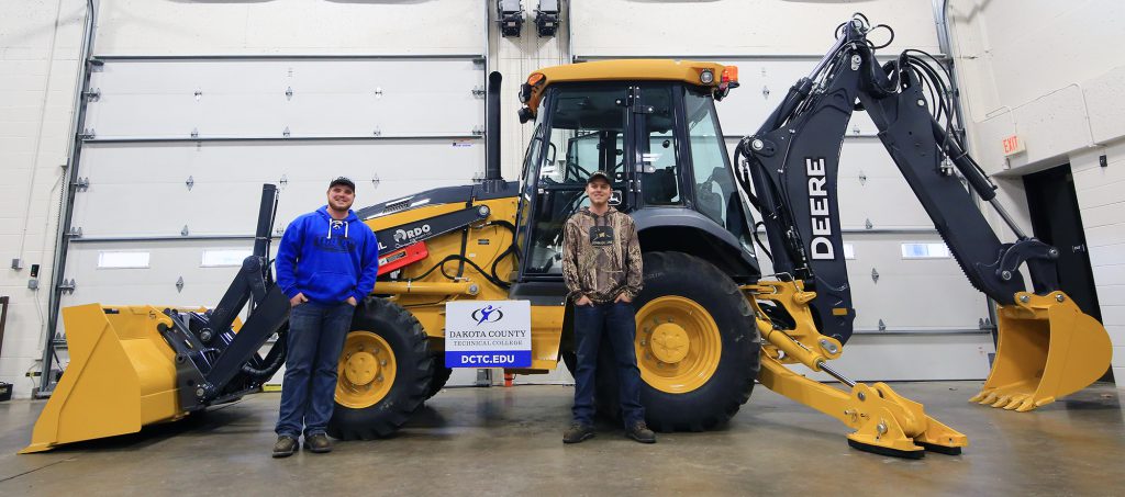 dctc's tweet image. A training boon for students in HCET, the backhoe loader represents a successful application of the #MNState Leveraged Equipment program.