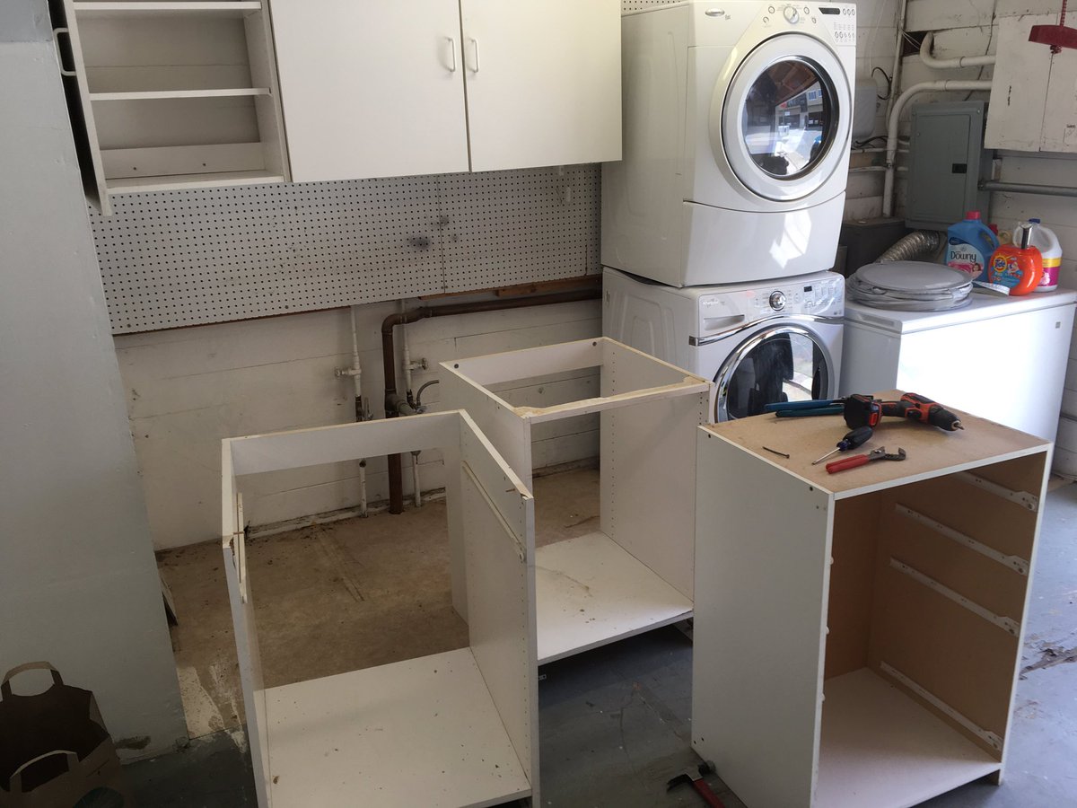 Our old, disgusting garage cabinets and sink being torn out