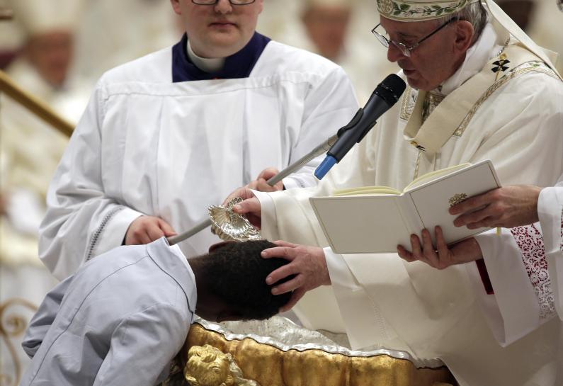 Reuters's tweet photo. Feel the pain of the poor and immigrants, pope says at Easter Vigil https://t.co/mbKCP6MSf4 https://t.co/A91iG1ntyp