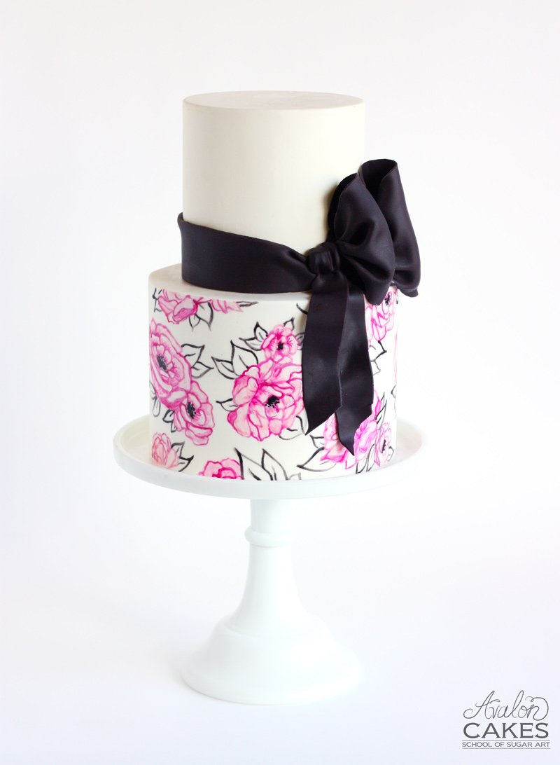 Realistic bow AND cocoa butter painted florals!
&gt;&gt;avaloncakesschool.com