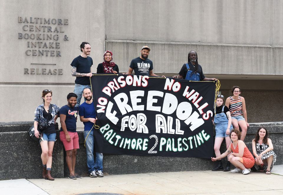 ISMPalestine's tweet photo. On time for the commemoration of #PrisonersDay in #Palestine, Baltimore Palestine Solidarity and Baltimore Jail support did a banner drop https://t.co/IWaYJ7dxlh