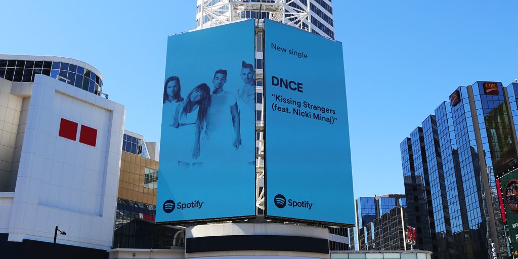 DNCE's tweet photo. TORONTO CHECK THAT #KISSINGSTRANGERS BILLBOARD POSTED UP ON YONGE &amp; DUNDAS!! THANK U @SpotifyCanada !!! https://t.co/AuXb6YiKK9 https://t.co/frZ6Faroah