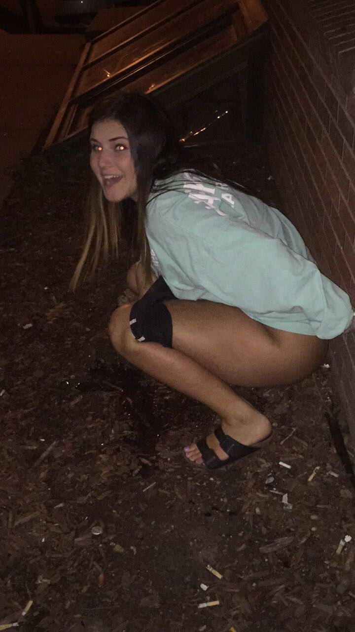 girl peeing out side  / X