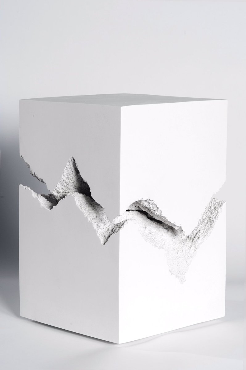 Split, cast marble stool. Created from two broken halves of a single rectilinear volume