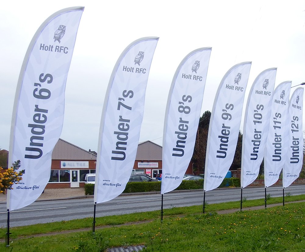 Not the best weather when taking these, we hope the sun will shine when they're used! #featherflags #eventgraphics #brandedflags