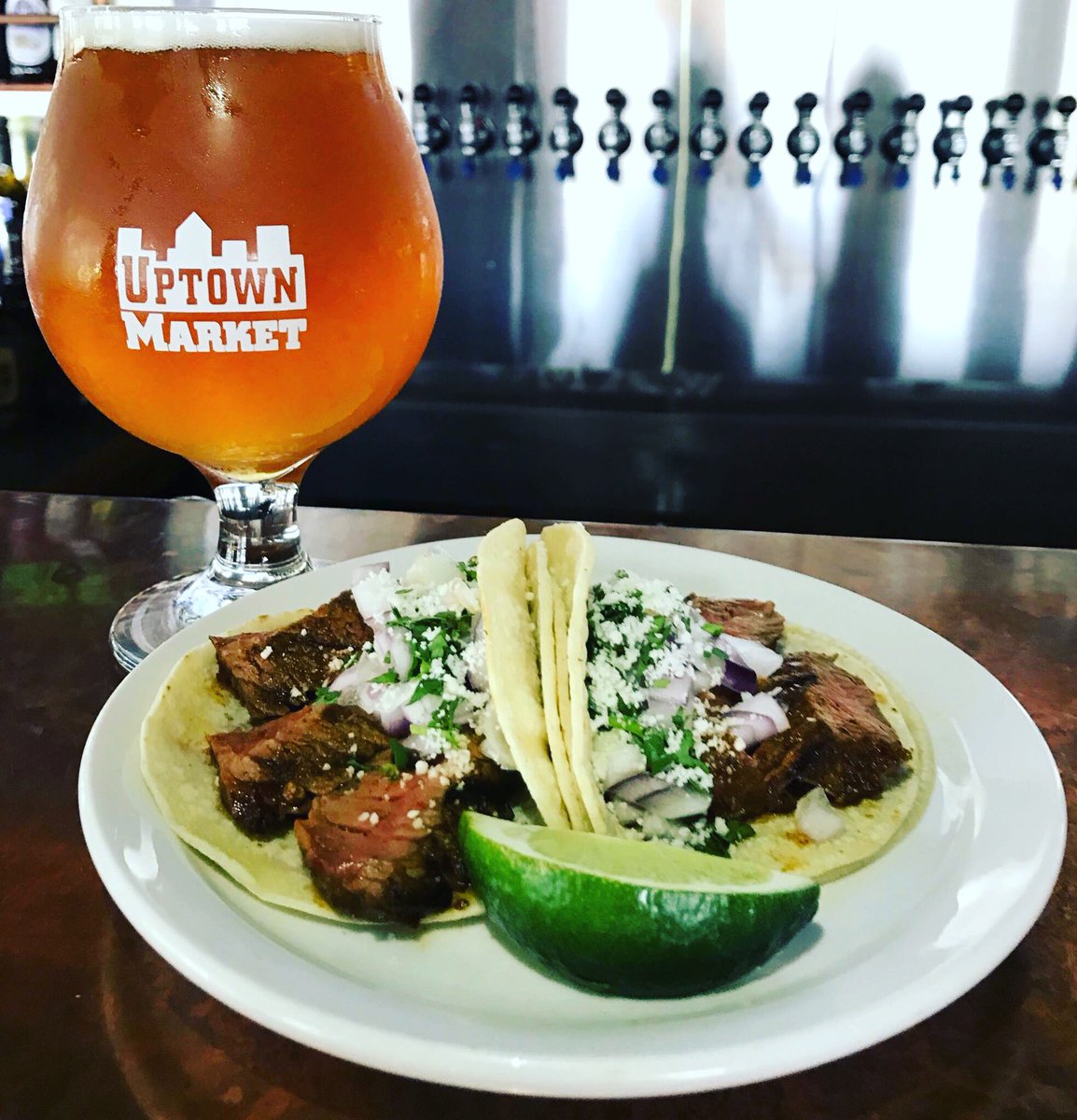 Who wants a taco? YOU want a taco!! Two carne asada taos served on corn tortillas with onion, cilantro and cojita cheese. #tacotuesday