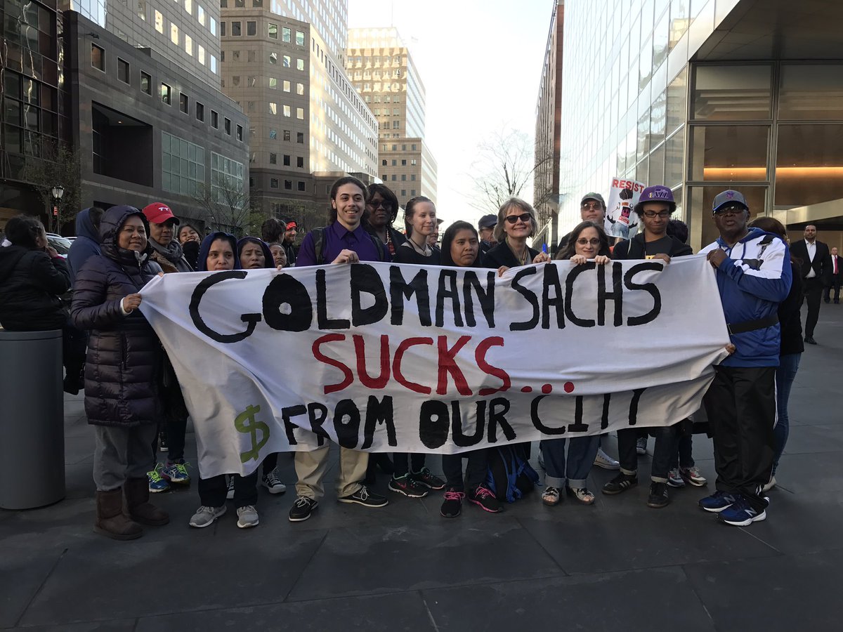 Govt_Sachs's tweet photo. Activists rally at @GoldmanSachs to demand that they pay what they owe #TaxDay #ResistTrumpTuesdays #GovernmentSachs https://t.co/x4S8PkwrLQ