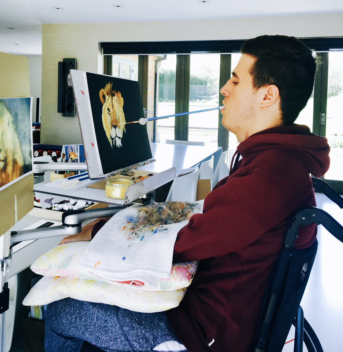 My mouth painting. I'm only physically able to paint by holding the brush in my mouth.

'The King Of The Jungle II'. instagram.com/p/BTEwlZNhJag/