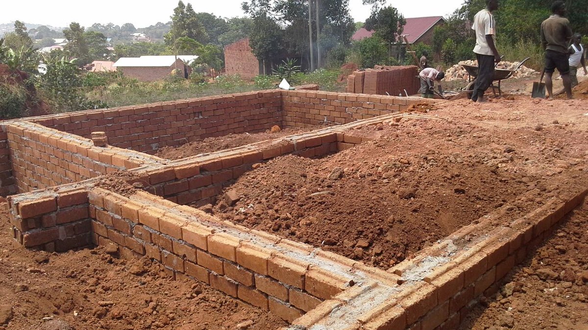 thetownbuild's tweet photo. with #LowCostStrategies @thetownbuild in Nansana subStructure has been completed with Locals&amp; @PeaceCorps Volunteers http://t.co/68TmX7bOJv