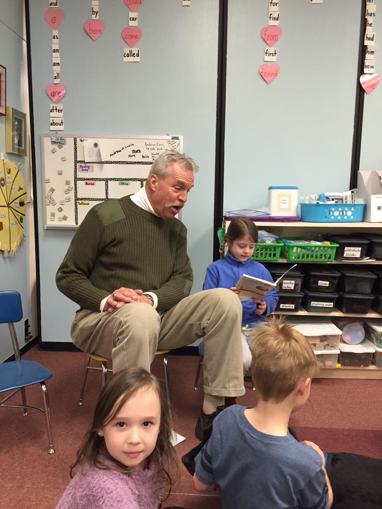Mr. Steve is back with Gunny and Duffy reading to our first graders