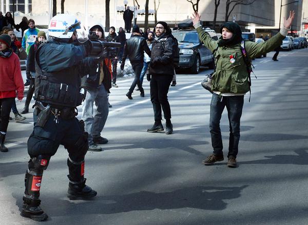 OccupyRMN's tweet photo. RT @UptheCypherPunx
#Montreal riot cop aiming at a student/anti-#austerity protester. #redspring2015 #irishwater http://t.co/5nO5Xk5TX9