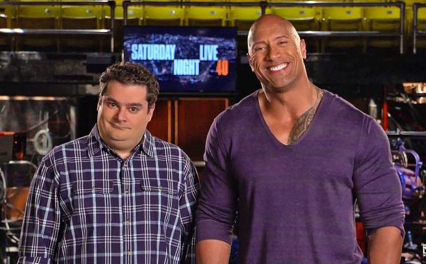 TheRock's tweet image. Hit 'em right in the "feelies". #SNL #4xHost RT: @EW: @TheRock drops the mic in @nbcsnl promo: ow.ly/KN8hu
