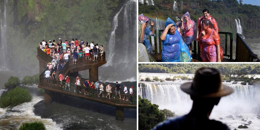 AP_Images's tweet photo. Tourists soak in the spray from #Iguazu falls: http://t.co/r2bh4jgask #Argentina #Brazil @jsaenz1958 #APIBlog http://t.co/qR5ZOeWyJW