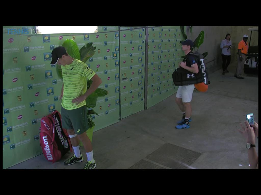 AndyMurrayFans's tweet photo. Oh hi Andy! Wearing a crisp black shirt, white shorts, #AM77 logo on sleeve... http://t.co/0BvKCFn1Jm
